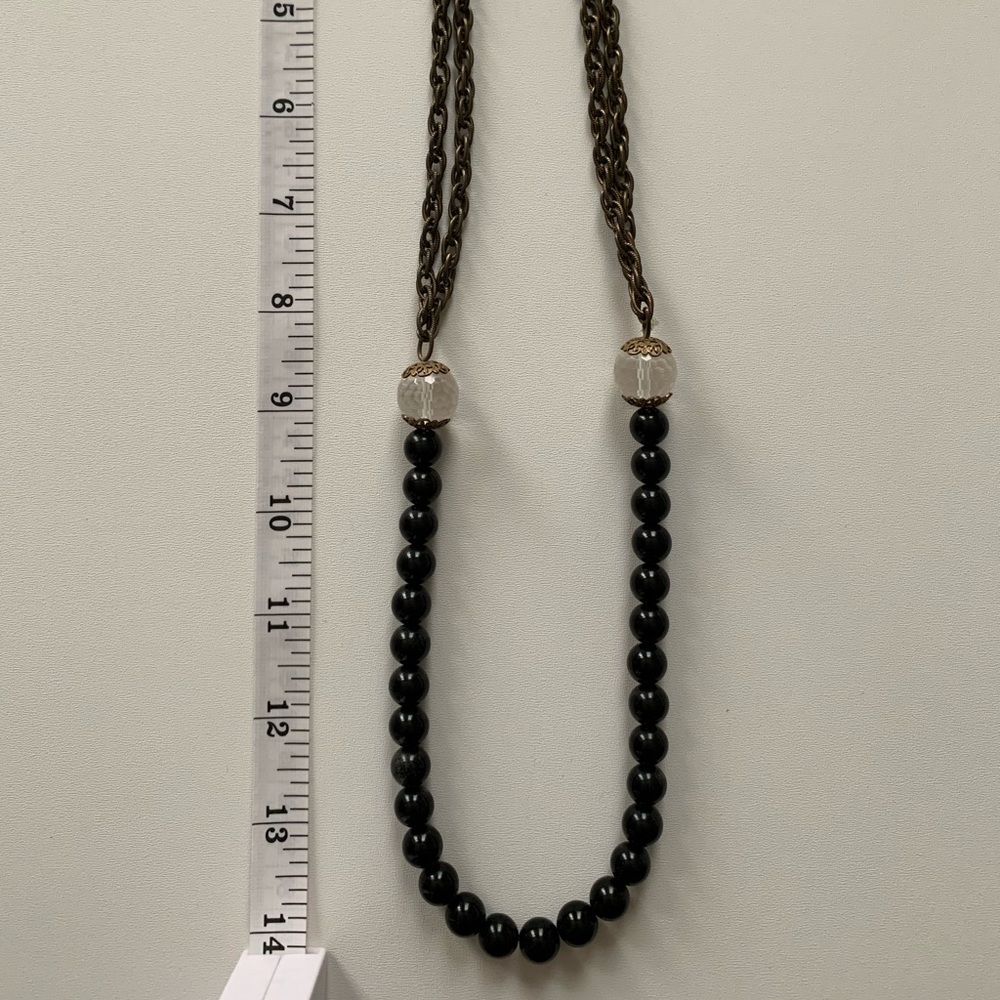 Anthropologie black and hold long beaded necklace